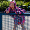 A woman wearing a baja on rollerskates