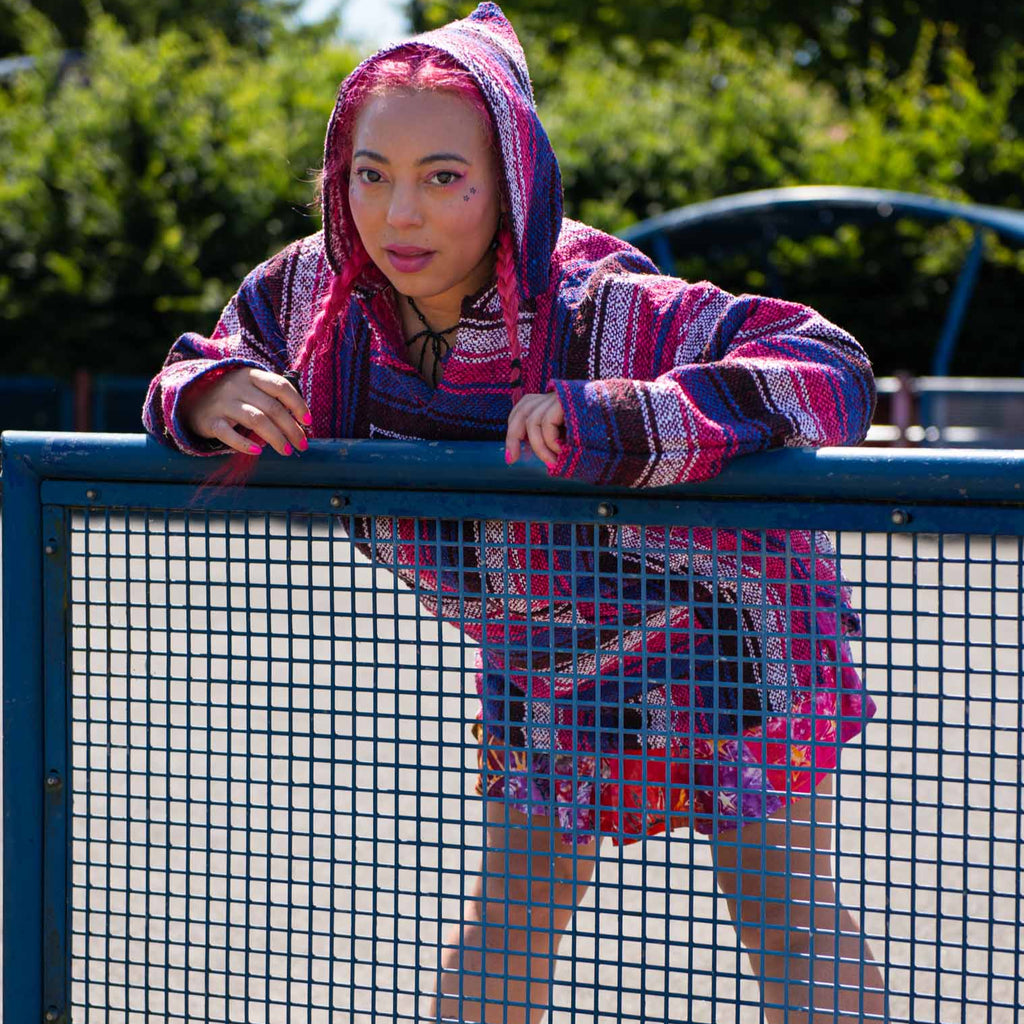A woman wearing a baja on rollerskates